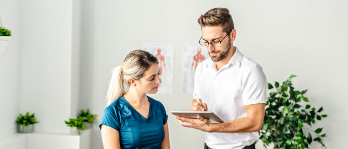 a doctor talking to a female patient