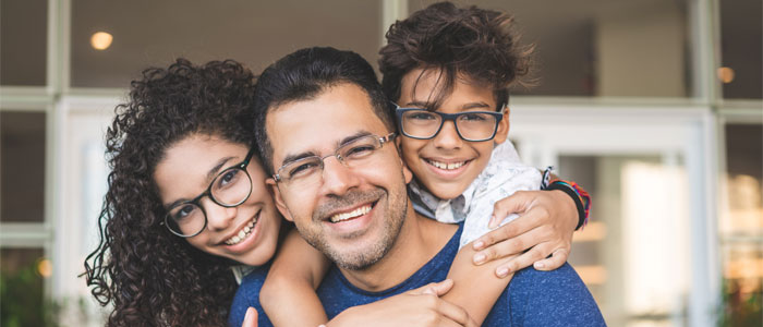 man holding children